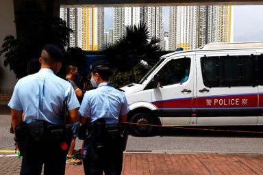 A police van carries a member of Hong Kong University