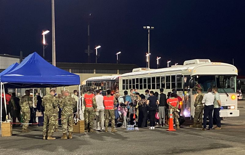 Evacuees from Afghanistan arrive at the US military airbase in