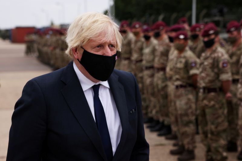 FILE PHOTO: Boris Johnson visits British military personnel who worked