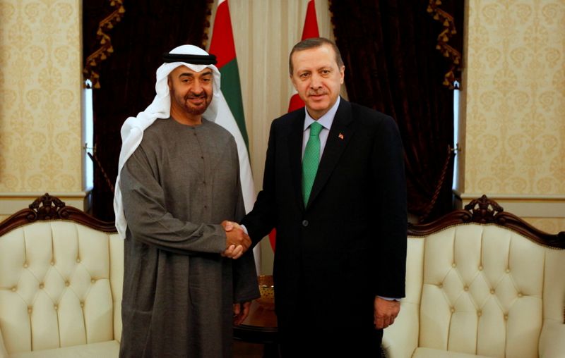 FILE PHOTO: Abu Dhabi’s Crown Prince Sheikh Mohammed shakes hands