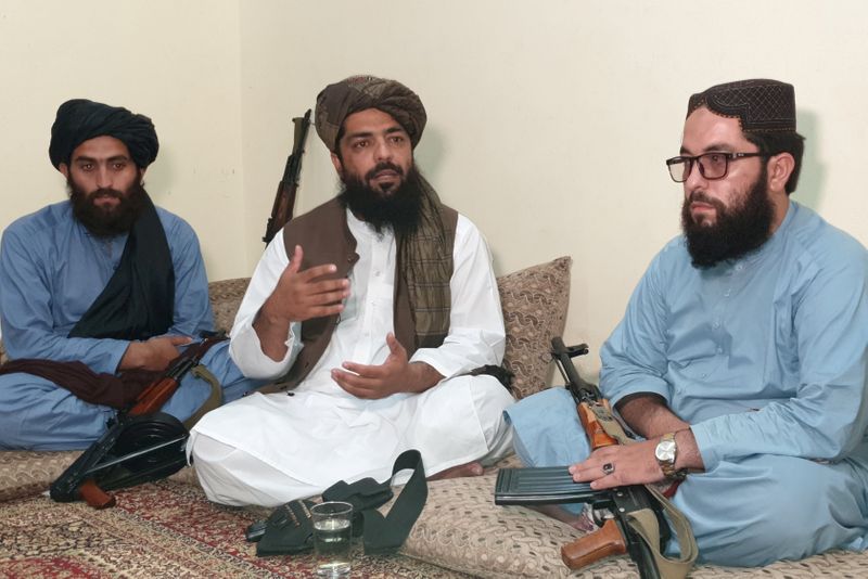 FILE PHOTO: Waheedullah Hashimi, a senior Taliban commander, speaks with
