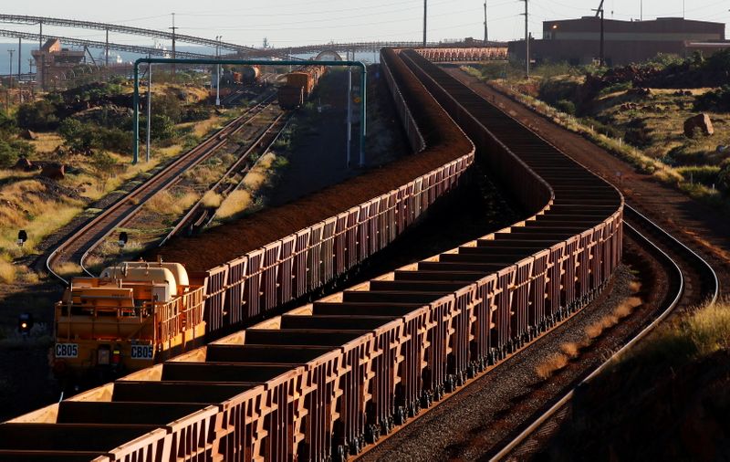 FILE PHOTO: A train loaded with iron ore travels towards