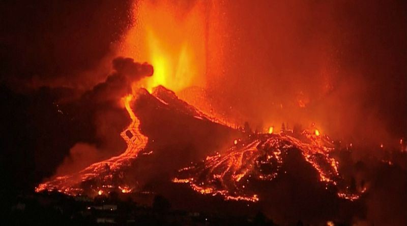 Lava pours out of a volcano on La Palma in