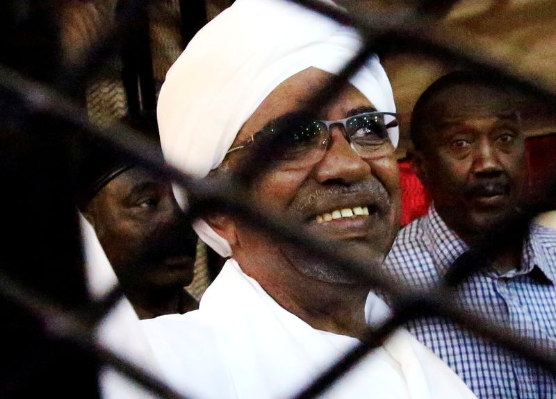 FILE PHOTO: Sudan’s former president Omar Hassan al-Bashir smiles as
