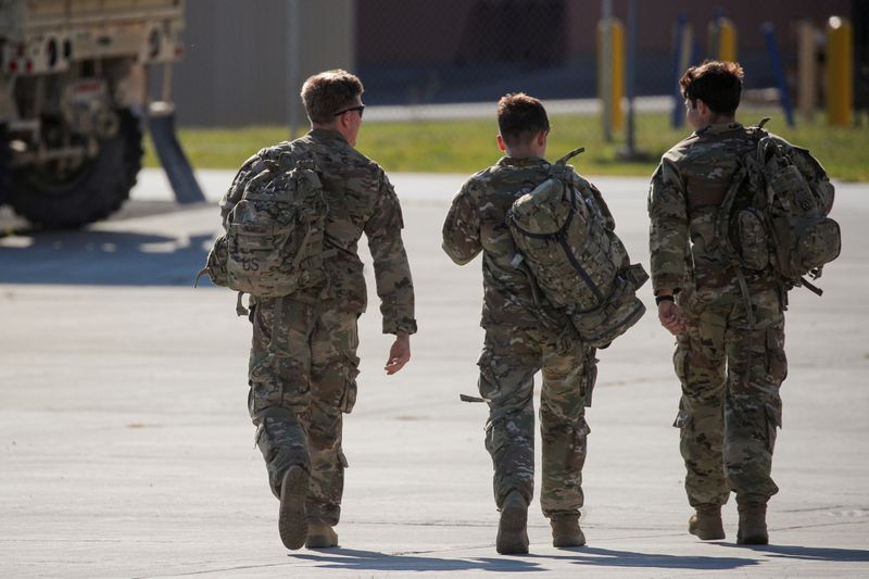 FILE PHOTO: Soldiers walk together after returning home from deployment
