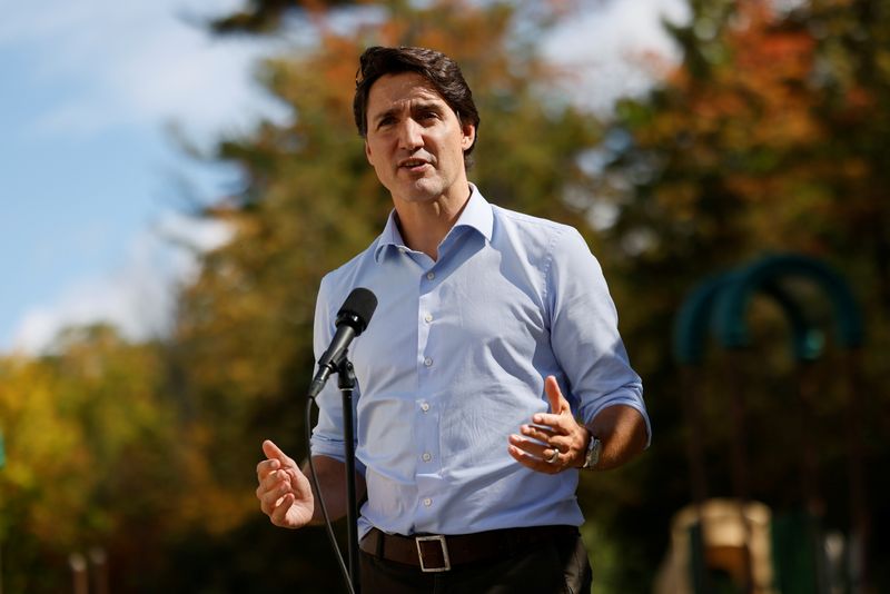 Canada’s Prime Minister Justin Trudeau speaks to media after visiting