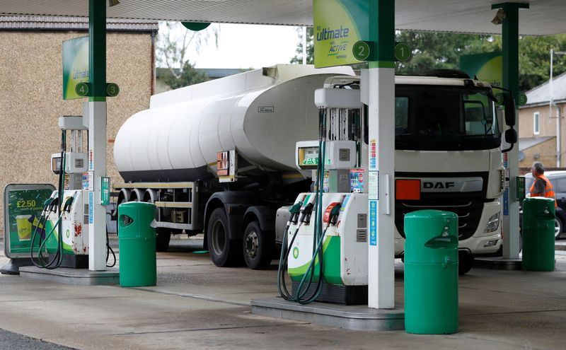 A fuel tanker is parked during a fuel delivery to
