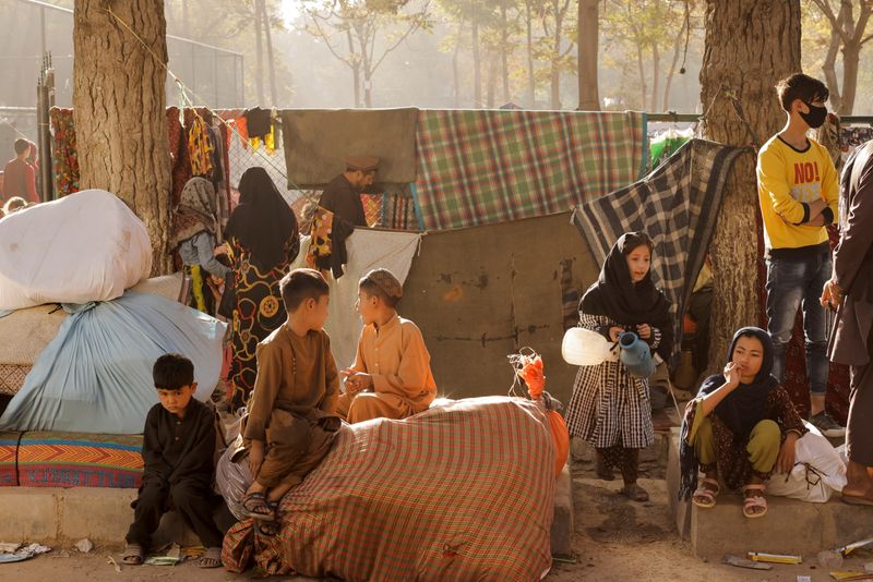 Displaced Afghan families, who flee the violence in their provinces,
