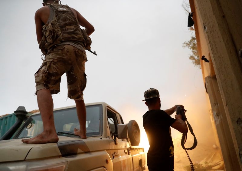 FILE PHOTO: Fighters loyal to Libya’s U.N.-backed government (GNA) fire