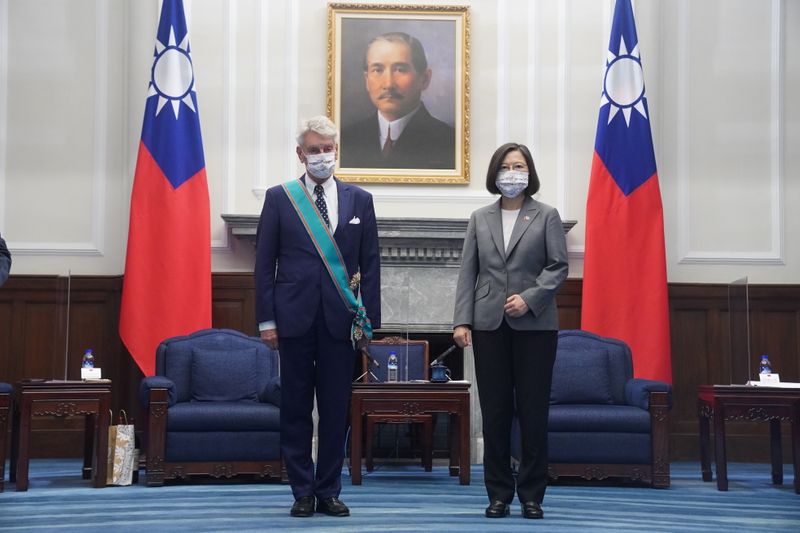 Taiwan’s President Tsai Ing-wen stands next to French Senator Alain