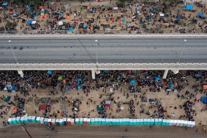 FILE PHOTO: Migrants shelter near Del Rio International Bridge in