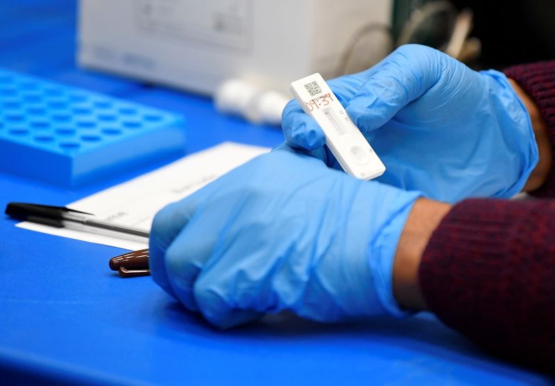 FILE PHOTO: Students take coronavirus disease (COVID-19) tests in London