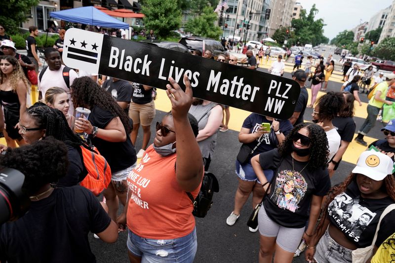 FILE PHOTO: People celebrate Juneteenth at Black Lives Matter Plaza