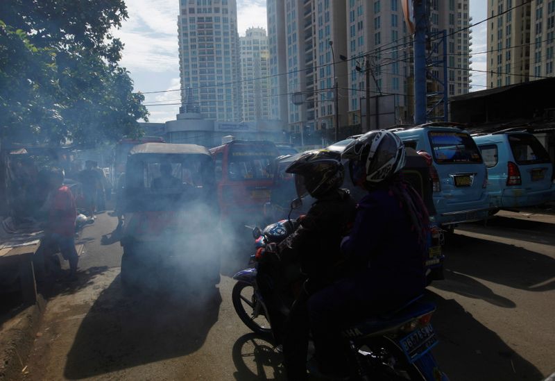 FILE PHOTO: Exhaust fumes are seen coming from a vehicle