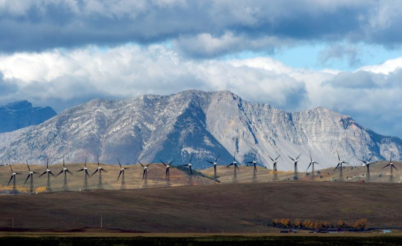 FILE PHOTO: Windmills generate electricity in the windy rolling foothills