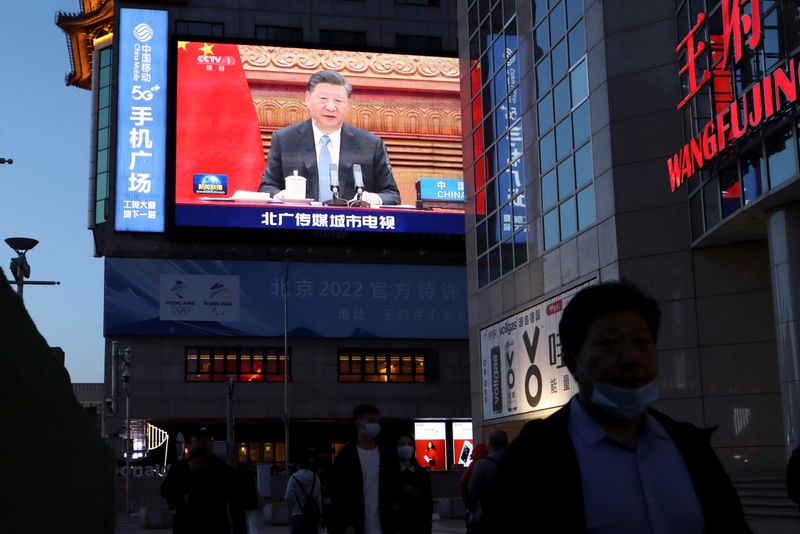 FILE PHOTO: Giant screen shows news footage of Chinese President