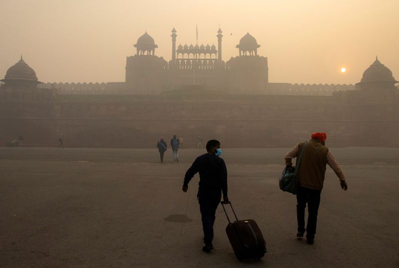 FILE PHOTO: People arrive to visit the Red Fort on