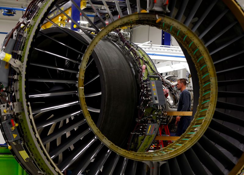 FILE PHOTO: A General Electric employee inspects a jet engine