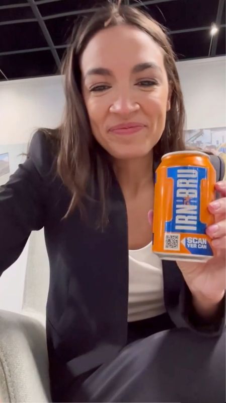U.S. Representative Alexandria Ocasio-Cortez (D-NY) shows a can of Irn-Bru