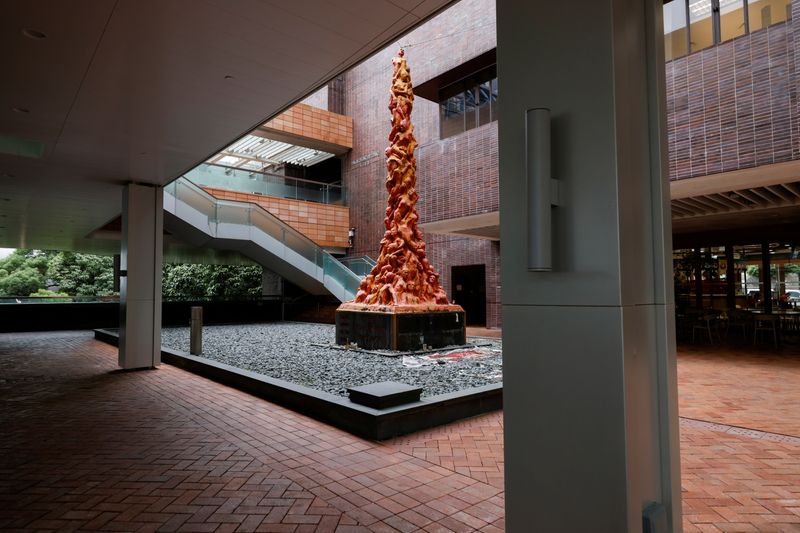 “Pillar of Shame” by Danish sculptor Jens Galschiot is set