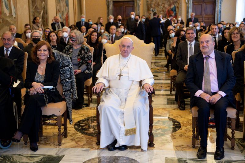 Pope Francis attends a ceremony to honour veteran Vatican correspondents