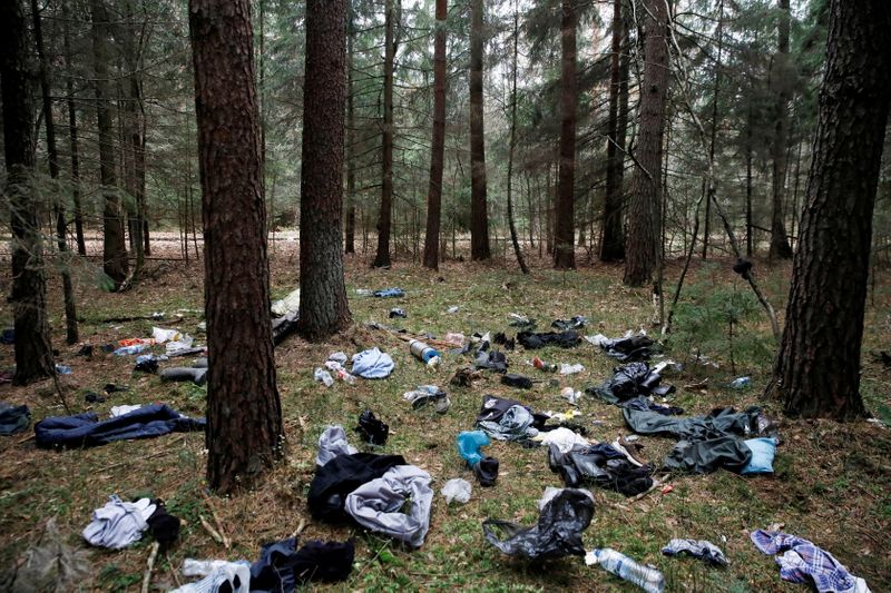 Belongings of migrants are pictured in the forest during the