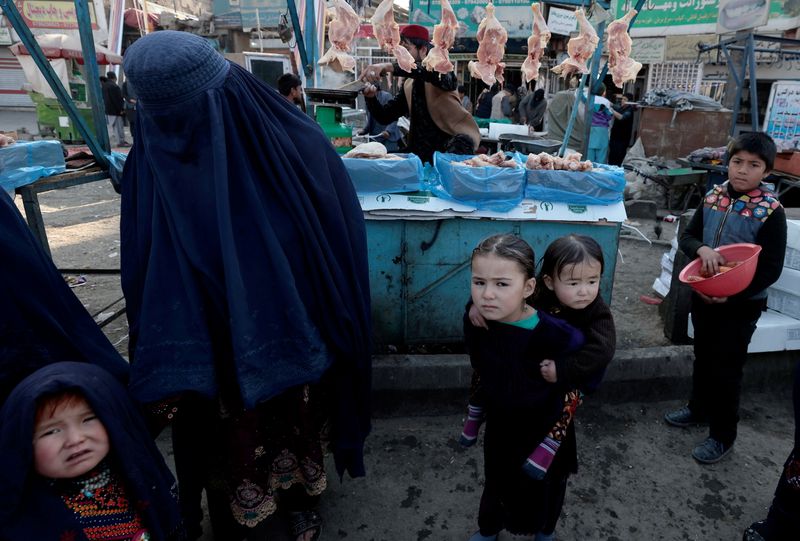 FILE PHOTO: A mother shops with her children at the