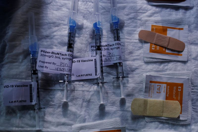 Syringes with a dose of the COVID-19 vaccine are ready