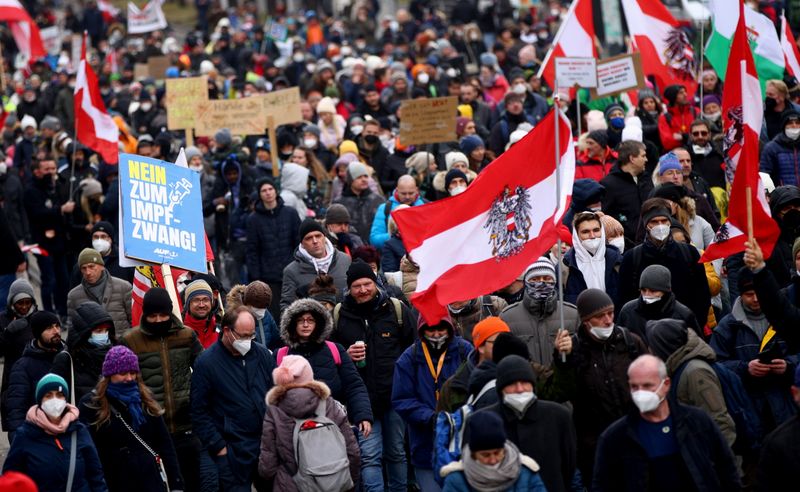 Thousands of people march to protest against restrictions on public