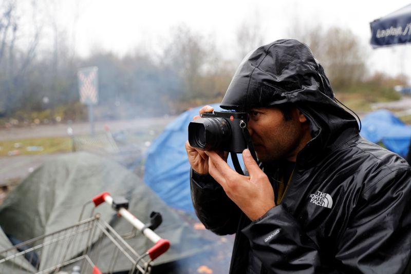 Afghan refugee and photographer Abdul Saboor at a makeshifts migrant