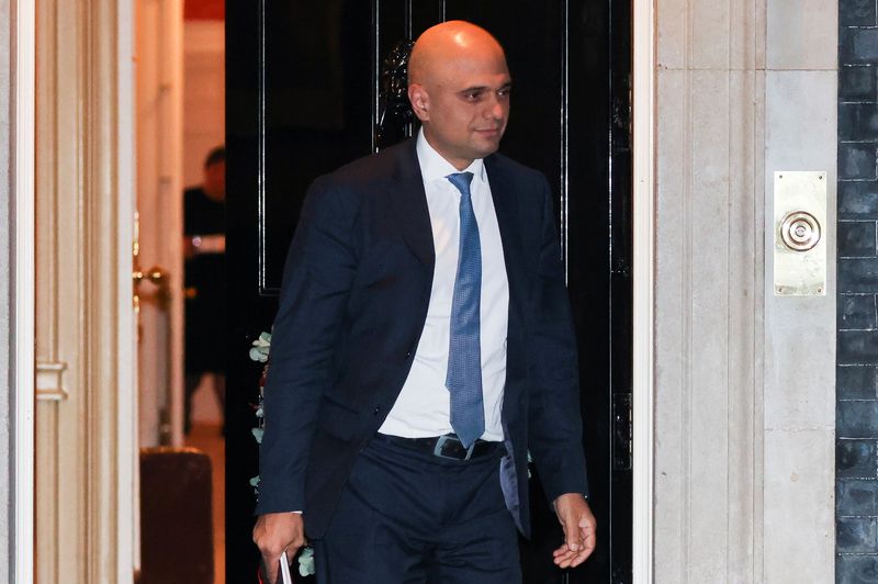 Britain’s Health Secretary Sajid Javid walks at Downing Street in