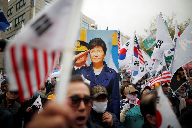 Supporters of ousted President Park Geun-hye gather outside a court