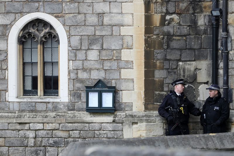 Police officers stand on duty at Windsor Castle in Windsor