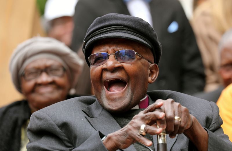 Archbishop Desmond Tutu laughs as crowds gather to celebrate his