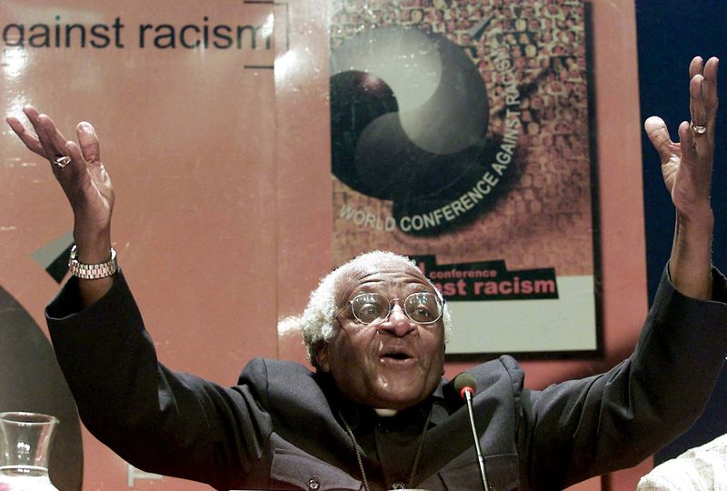 FILE PHOTO: Nobel Peace laureate Archbishop Desmond Tutu gestures as