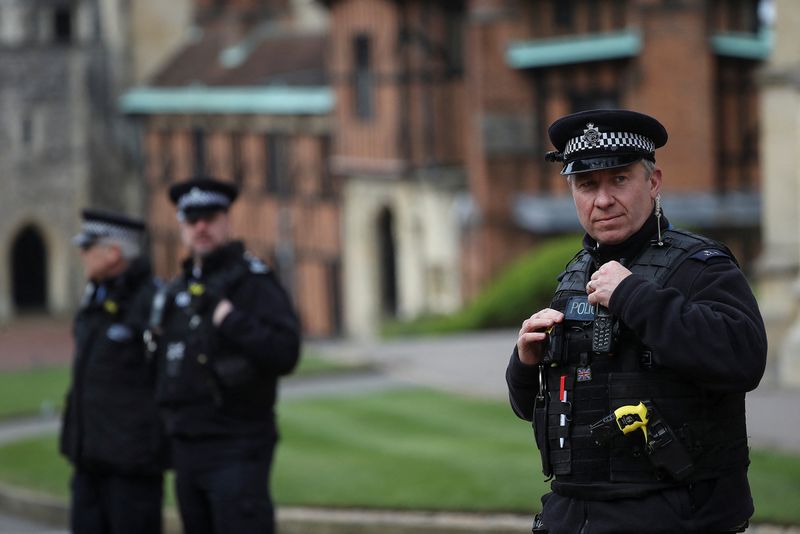 Police officers stand on duty at Windsor Castle in Windsor