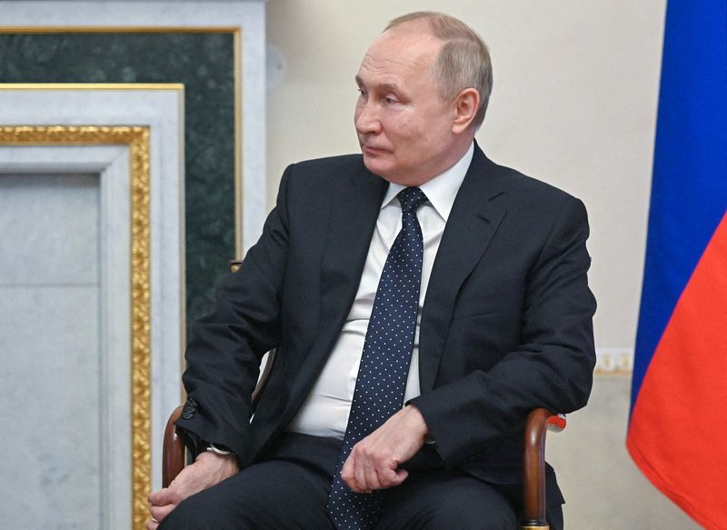 FILE PHOTO: Russian President Putin meets with Kazakh former President