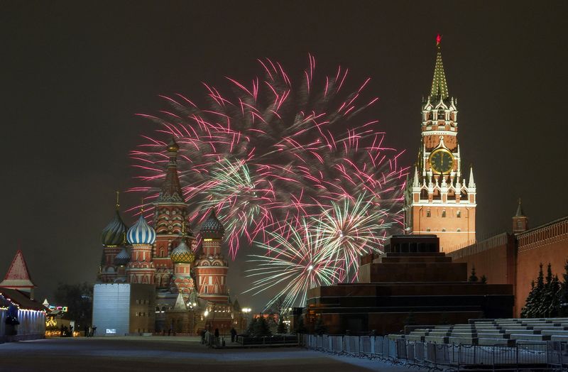 Fireworks explode in the sky over the Kremlin and St.