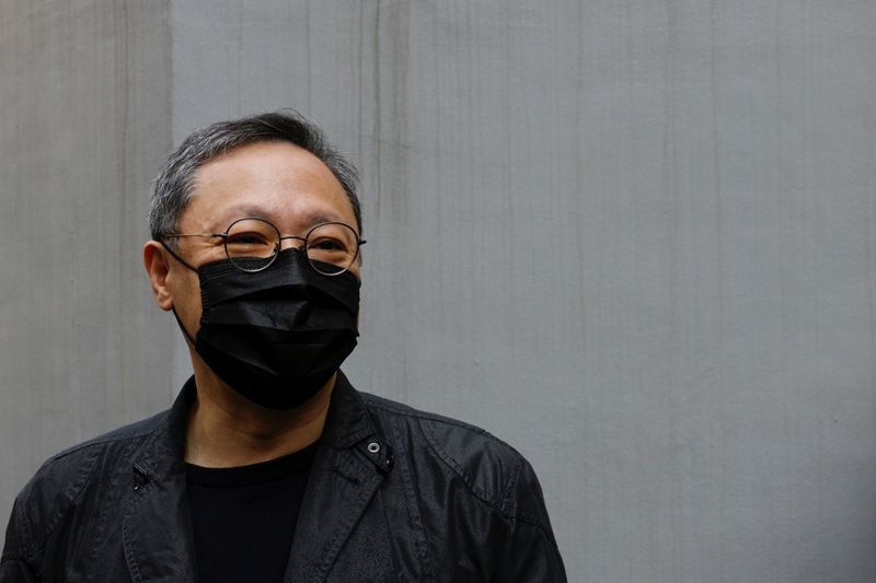 Pro-democracy activist Benny Tai reports to the police station over