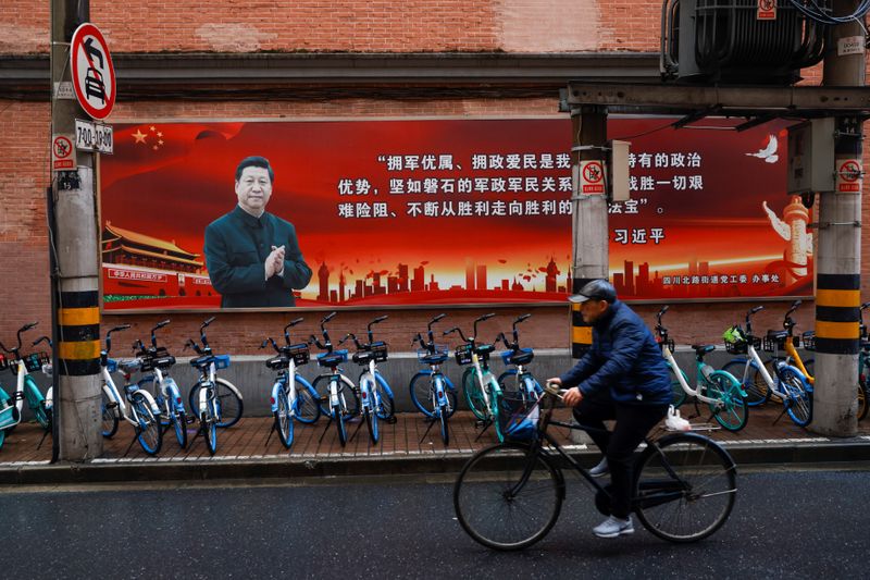 Pictures of Chinese President Xi Jinping overlook a street ahead