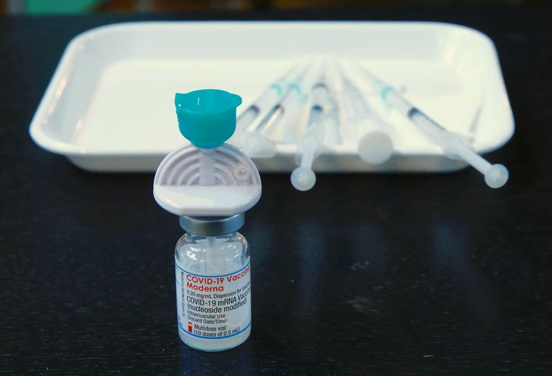 A  vial containing the Moderna COVID-19 vaccine is seen