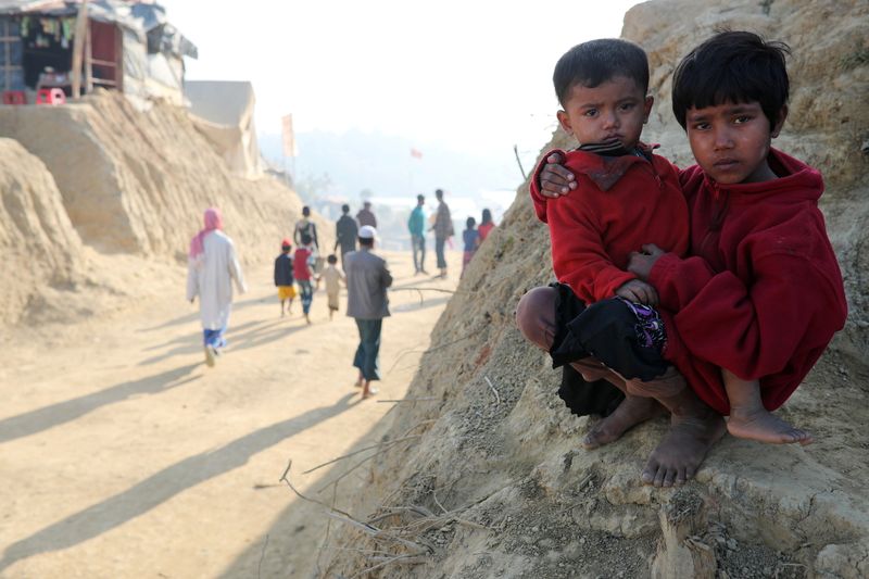FILE PHOTO: Rohingya refugee children look on at the Jamtoli