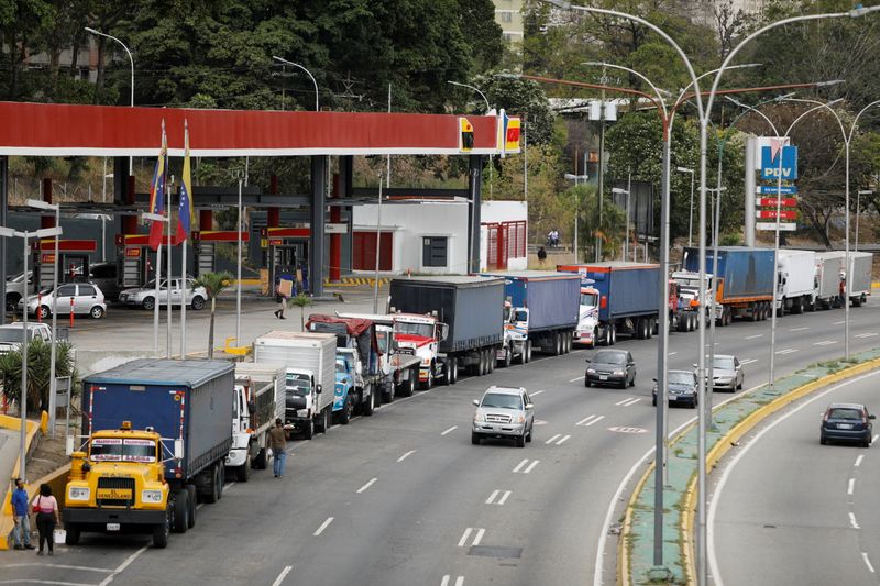 FILE PHOTO: Venezuelan truckers wait in long lines for fuel