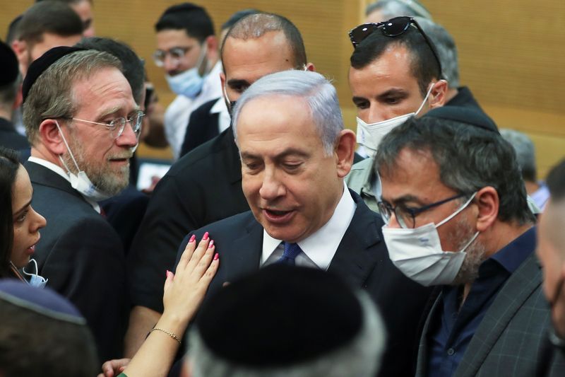 Israeli Prime Minister Benjamin Netanyahu looks on after a special