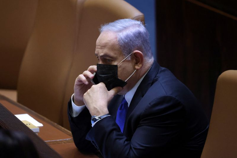 Israeli Prime Minister Netanyahu speaks on his mobile phone during