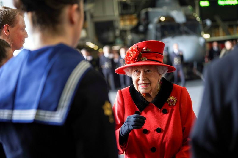 Britain’s Queen Elizabeth visits Royal Navy aircraft carrier HMS Queen