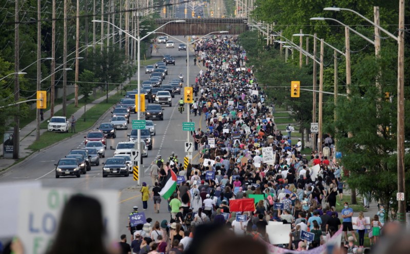 People march the 7km from a crime scene to a