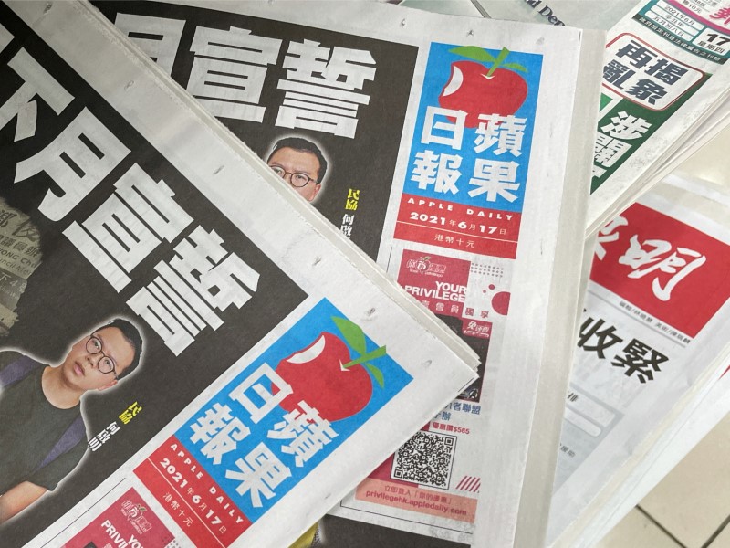 Copies of Next Digital’s Apple Daily newspapers are seen at