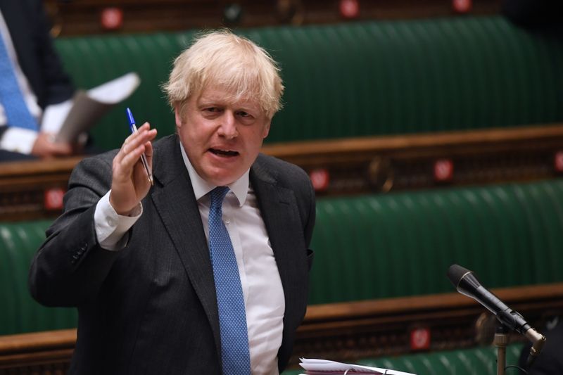British Prime Minister Boris Johnson takes questions in Parliament, in