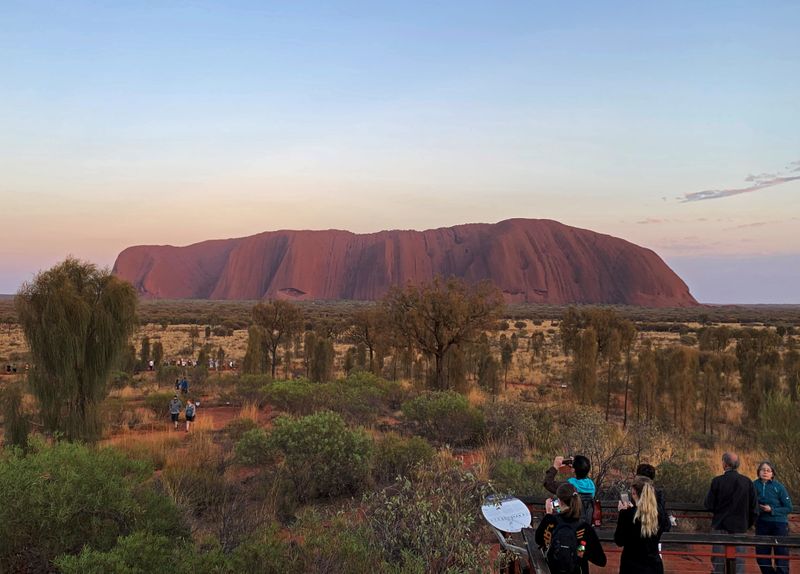 FILE PHOTO: People view Uluru, the day before a permanent